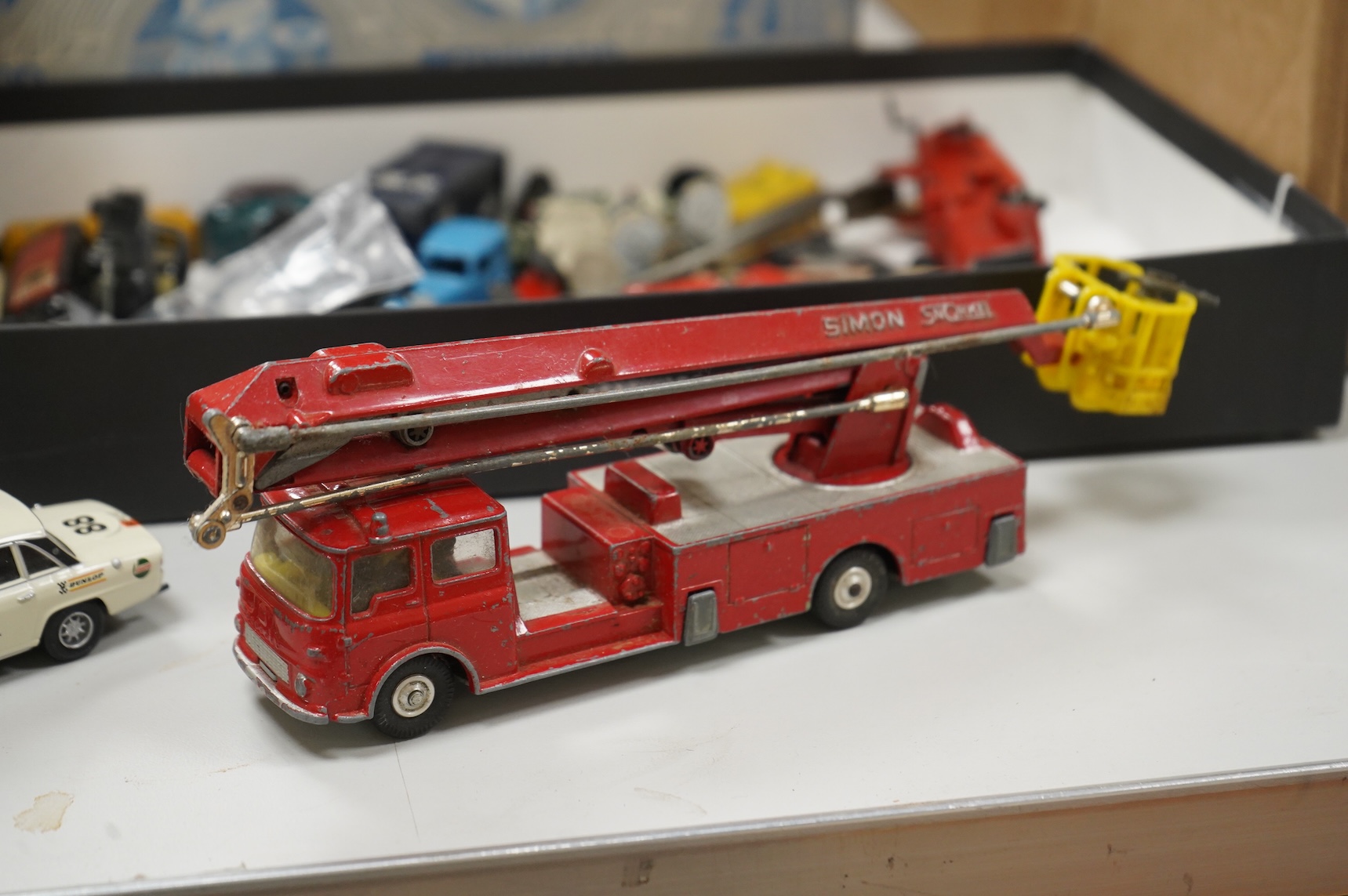 Twenty 1960s Corgi Toys, all playworn or restored examples in reproduction boxes, including cars, a milk float and two Land Rovers, etc., together with a quantity of additional diecast, etc. Vehicles by a variety of make